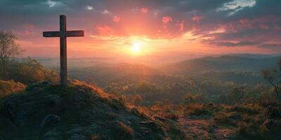 Sunset over a hilltop cross with vibrant colors reflecting the beauty of nature during twilight photo