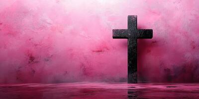Spiritual reflection on a black cross standing in still water with a pink misty background during twilight photo