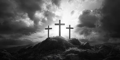 Four crosses stand prominently on a hillside under dramatic clouds at sunset, creating a powerful image of reflection and faith photo
