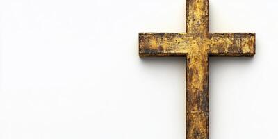 Wooden cross with a rustic finish displayed against a plain background photo