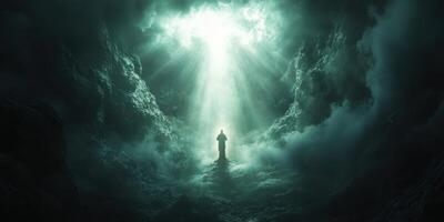 Light breaks through clouds illuminating a figure standing in a mystical atmosphere at dusk photo