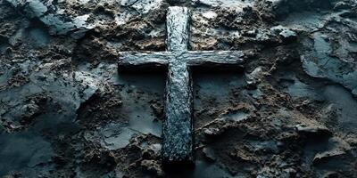 Black wooden cross lying on dark, textured surface symbolizing faith and spirituality photo