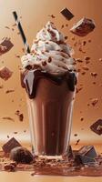 Indulgent chocolate milkshake topped with whipped cream and surrounded by chocolate pieces photo
