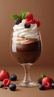 Delicious dessert with layers of chocolate cream and fresh berries garnished with mint on a neutral background photo