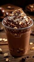 Indulgent chocolate dessert topped with whipped cream and nuts served in a transparent cup photo