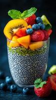 Colorful fruit salad with chia seeds served in a glass, showcasing fresh fruits and healthy ingredients photo