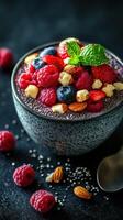 Chia seed pudding topped with fresh berries, nuts, and mint on a dark background photo