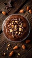 Delicious chocolate dessert topped with nuts and crunchy pieces ready to be enjoyed in a cozy setting photo