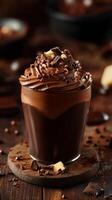 Rich chocolate dessert topped with whipped cream and chocolate decorations served in a cozy cafe setting photo