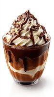 Creamy chocolate dessert with whipped cream and chocolate shavings served in a glass cup photo