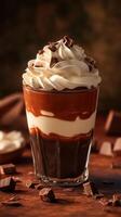 Decadent layered dessert with chocolate and whipped cream in a glass on a rustic wooden surface photo