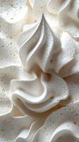 Creamy whipped topping in intricate swirls displayed on a dessert at a cafe during afternoon hours photo