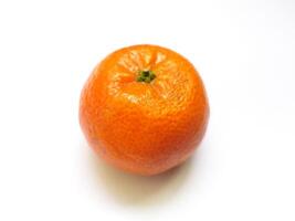 A vibrant, juicy mandarin orange sits on a stark white background. photo
