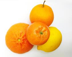 Vibrant citrus fruits oranges and lemon arranged on a white background. A refreshing image perfect for food blogs, health websites, or juice advertisements. photo