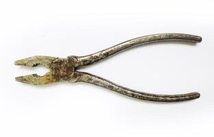 Rustic, aged pliers isolated on white. Shows wear and tear, suggesting a history of hard work. Perfect for concepts of craftsmanship, resilience, or the passage of time. photo