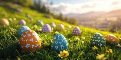 Colorful patterned eggs scattered across a vibrant green field during a sunny spring afternoon photo