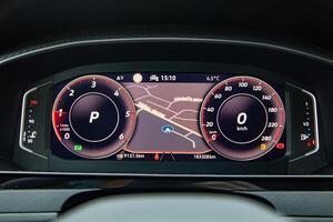 Dashboard screen with navigation on the car control panel, speedometer, fuel level and engine temperature level photo