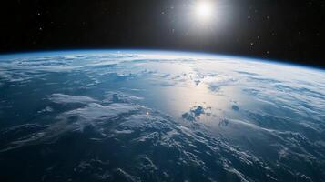 A clear blue sky with a bright sun shining down on the Earth. The sun is positioned in the middle of the sky, and the Earth is visible in the background photo