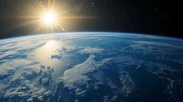 The sun is shining on the blue planet Earth The sky is clear and the sun is bright photo