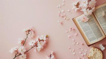 Open Bible with cherry blossoms Flat Lay Mockup on pink background photo