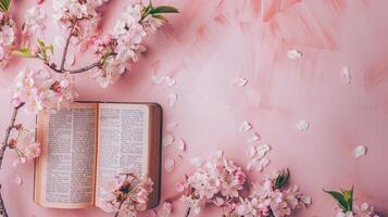 Open Bible with cherry blossoms Flat Lay Mockup on pastel background space for text photo