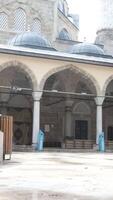 Man looking at the mosque video