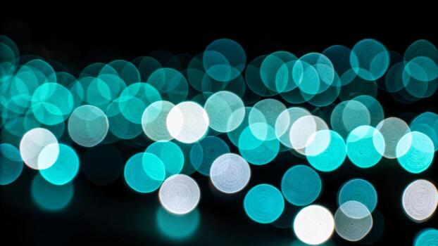 Vibrant close-up of glowing cyan bokeh circles in dark environment abstract art concept for visual aesthetics photo