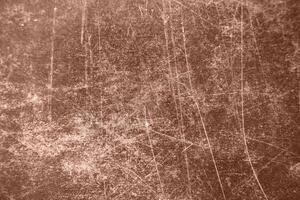 Artificial leather with brown scratches. Background with scratch surface texture. Color of the year 2025 Mocha Mousse. photo