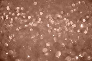 Color of the year 2025 Mocha Mousse. A defocused background is an abstract blurry light element. photo