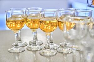 Wine glasses in a row. Festive buffet with wine tasting. The concept of holidays and entertainment. With space to copy photo