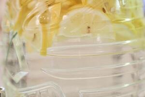 A healthy cocktail of water infused with citrus fruits and lemon. Diet drinks for detoxification with space to copy photo