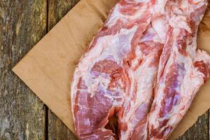Fresh uncooked raw sliced meat Raw pork on cutting board photo