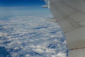 clouds. top view from the window of an airplane flying in the clouds. cloud spreading to the horizon photo