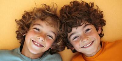 Joyful Young Kids Smiling Together on a Bright and Colorful Background with Cheerful Energy photo