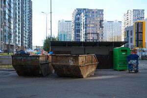garbage containers and plastic containers in a residential area photo