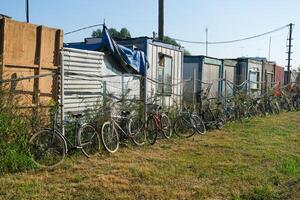 Containers for construction workers with bicycles next to them photo