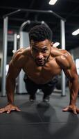 Athletic Black Fitness Enthusiast performing midpushup at a hightech gym photo