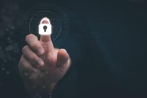 a person pressing a button with a padlock on it photo