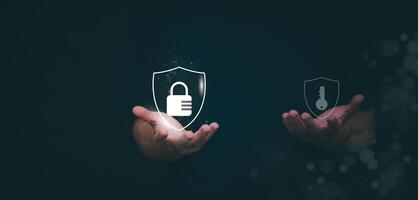 a person holding up two icons of a lock and a key photo