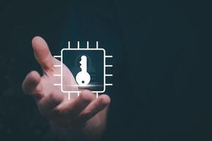 a person holding a key in their hand with a computer chip icon photo