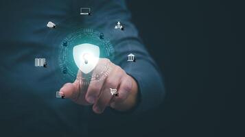 a man holding a button with icons of security and internet connected devices photo