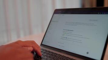 Close-up shot of hands typing on a laptop keyboard, focused on an open email inbox, suggesting online communication or remote work. Chat with modern technology chatbots video