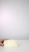 Empty bowl on white table in minimalist setting, highlighting calm and simplicity video