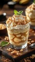 Enjoying a delicious banana cream dessert topped with whipped cream and crushed cookies at a cozy cafe setting photo
