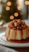 Delicious dessert featuring caramel sauce and nuts served on a white plate photo