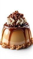 Delicious caramel dessert topped with whipped cream and crunchy sweets on a white background photo