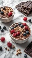 Delicious chocolate mousse topped with fresh berries and nuts in a cozy kitchen setting photo