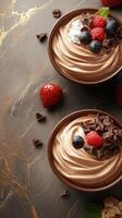 Satisfying dessert bowls featuring chocolate mousse with fresh berries and chocolate shavings on a decorative surface photo