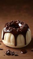 Delicious dessert with chocolate glaze and chocolate shavings on a wooden table photo