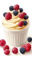 Creamy vanilla dessert topped with fresh berries in a stylish cup at a sunny outdoor event photo